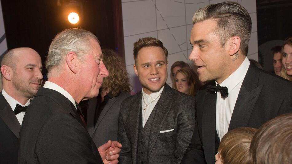 Charles und Robbie Williams bei einer Begegnung im Jahr 2013.