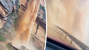 Vorhang aus Schlamm: Fahrer durchquert reissenden Wasserfall auf Bergstrasse in China