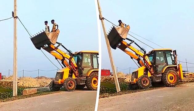 Männer nähern sich in Baggerschaufel einem Strommast – dann gibt der Fahrer Gas