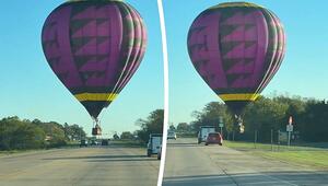 Haarscharf über den Autos: Heissluftballon schwebt über Highway