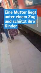 Mutter schützt Kinder vor Zug