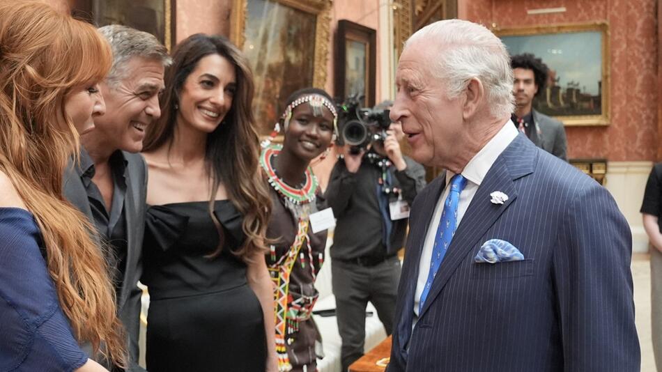 George und Amal Clooney bei ihrem Wiedersehen mit König Charles.