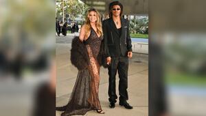 Heidi Klum strahlt mit ihrem Sohn Henry in die Kamera.