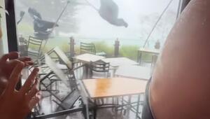 Powerful tornado sweeps tables, chairs, and umbrellas across a restaurant in Australia